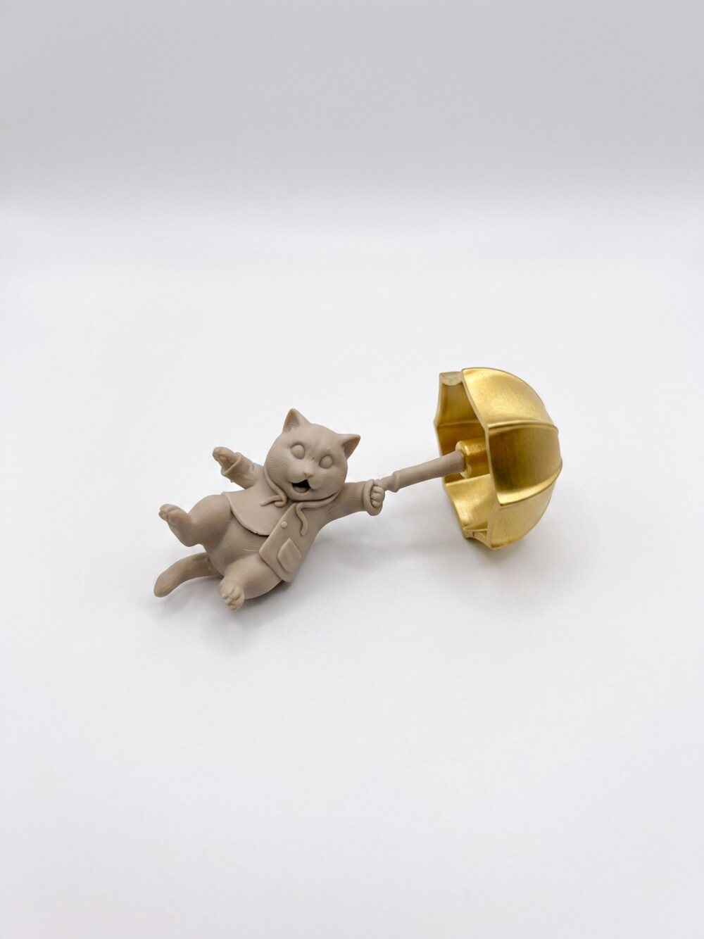 Breezy Kitty Vent Clip — cat holding a gold umbrella